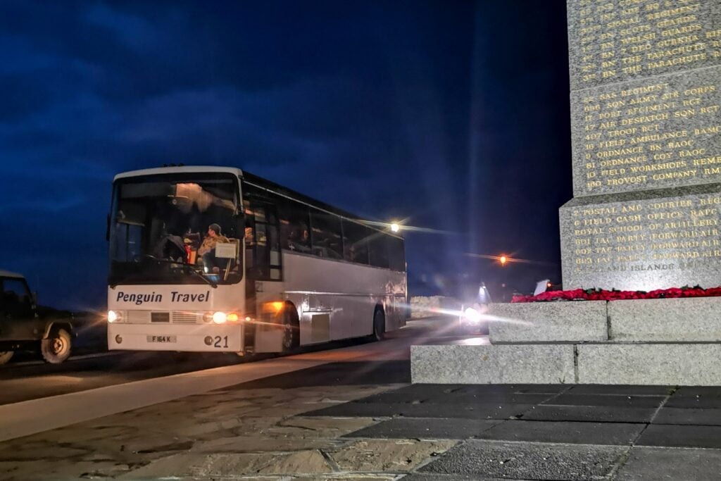 Penguin Travel coach in front of Liberation Monument